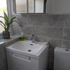 Photo 7: Bright modern bathroom.