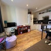 Photo 6: Living room / kitchen (there aren’t normally that many drying dishes, honest :D )