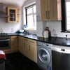 Photo 8: Kitchen comes fully equipped with pots and pans, plates, utensils 