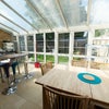 Photo 3: Conservatory with dining table and breakfast bar table