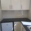 Photo 6: Utility room with freezer and washing machine 