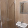 Photo 5: Modern shower , bathroom sink and toilet 