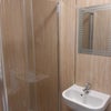 Photo 6: Modern shower , bathroom sink and toilet 