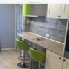 Photo 2: Useful comfortable breakfast bar area, as well as separate table and chairs.