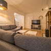 Photo 4: Another view of the lounge with the TV