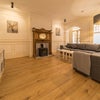 Photo 3: Fantastic living room with this super large corner sofa and smart TV