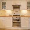 Photo 6: One side of the kitchen with mod cons