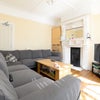 Photo 3: The cosy lounge with comfy corner sofa and TV