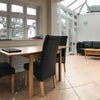 Photo 4: The dining table at the end of the kitchen with a chill out area - great for reading