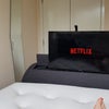 Photo 2: TV pops up from bed