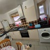 Photo 2: Kitchen with table & TV