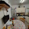 Photo 3: Kitchen with table & TV