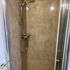 Photo 9: Spacious shower with easy clean splashwall & chrome fittings.