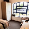 Photo 2: Double bed and matching furniture plus a desk with a view.