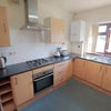 Photo 8: Kitchen with gas hob and electric oven, plenty of storage space and two large fridge freezers.