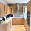 Photo 3: Kitchen with patio doors to garden
