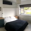 Photo 6: Small wardrobe, two small chests of drawers, desk/dressing table, bedroom. Office chair. 