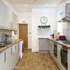 Photo 7: Modern, fully equipped kitchen with 2 washing machines and a tumble dryer