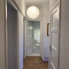 Photo 6: Corridor (from bathroom, built-in cupboard on right, kitchen at far end)