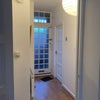 Photo 8: Entrance hall with original 1950s door; small WC on right