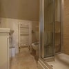 Photo 6: A lovely new bathroom with marble style wall tiles, walk-in shower & wall cupboards.