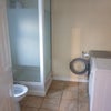 Photo 5: Shared shower and utility area