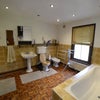 Photo 7: One of the bathrooms, this one has the double ended bathtub, separate shower, sink and toilet.
