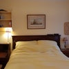 Photo 1: Sunny east facing front bedroom with smart TV, & Netflx profile