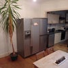 Photo 4: Kitchen with two American fridge freezers, dishwasher, etc