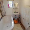Photo 7:  Shower over modern double ended bath
