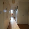 Photo 3: Hallway with storage cupboards