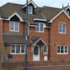 Photo 5: front of house with parking on drive