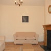 Photo 5: Spacious Lounge with High Ceilings & Ornate Fireplace