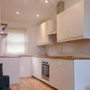 Photo 1: Open plan kitchen and living toom