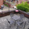 Photo 6: BBQ all year round with the outside table & chairs on the patio