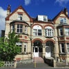 Photo 1: Victorian - style building