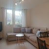 Photo 2: South-facing lounge, large John Lewis sofa, TV and sound bar