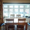Photo 4: LOUNGE 55" TV & DINING Room seats(6)