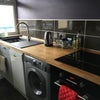 Photo 3: Kitchen with dishwasher, washing machine, new oven and hob