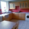 Photo 4: massive living area with the kitchen and all white goods including washing machine and drier 