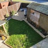 Photo 6: Well-maintained garden with 2x seating areas - one visible at top of photo, the other under roof str