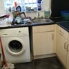 Photo 4: the cooker here is now new and is gas..wash machine also new replaced.