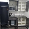Photo 6: Kitchenette - open cupboards 