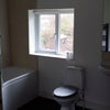 Photo 4: Bathroom with shower within the Bath