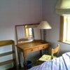 Photo 5: Bedroom 1 Desk, Chair, Bookcase, Dble. Bed, blind, bin & light