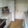 Photo 5: Kitchen - washing machine, microwave, oven, storage space, fridge/freezer