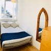 Photo 1: Single bedroom with large floor to ceiling wardrobe
