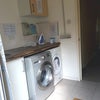 Photo 6: Utility room with dryer and Washing Machines
