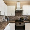 Photo 3: Small kitchen- working induction cooker and oven, toaster and washing/drying machine. No dishwasher.