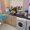 Photo 6: Downstairs utility room with two washers and dryer and toilet (your main bathroom is upstairs)